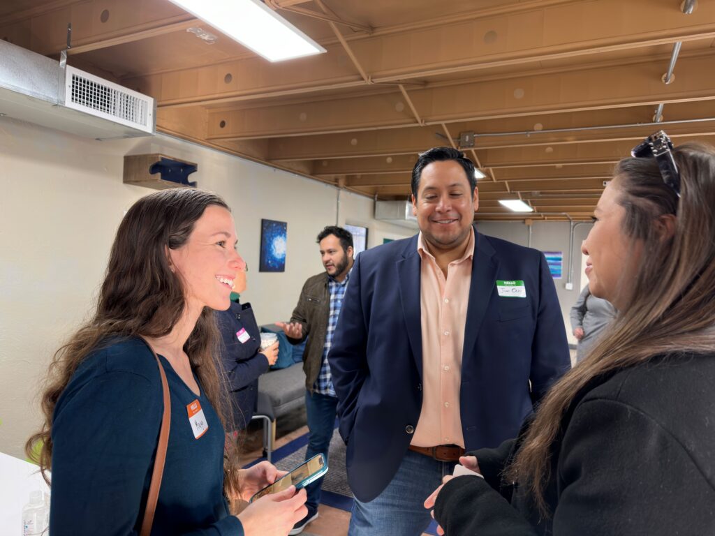 three people having a discussion